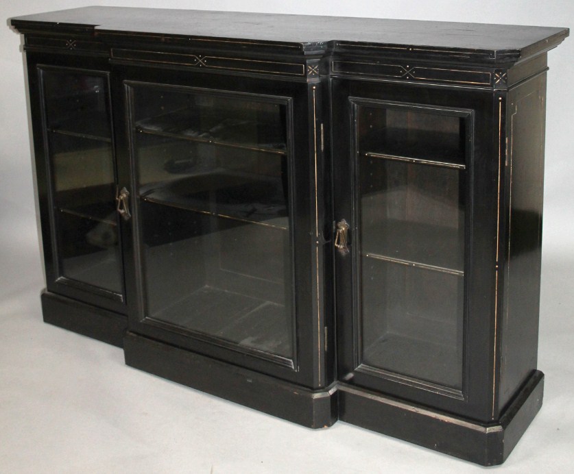 Appraisal: A late Victorian ebonised break front credenza the moulded over