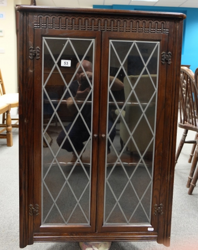 Appraisal: Oak linen fold corner display cabinet