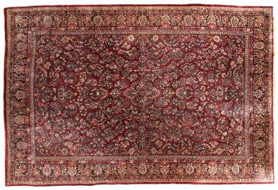 Appraisal: Room size Sarouk rug repeating floral designs on burgundy field