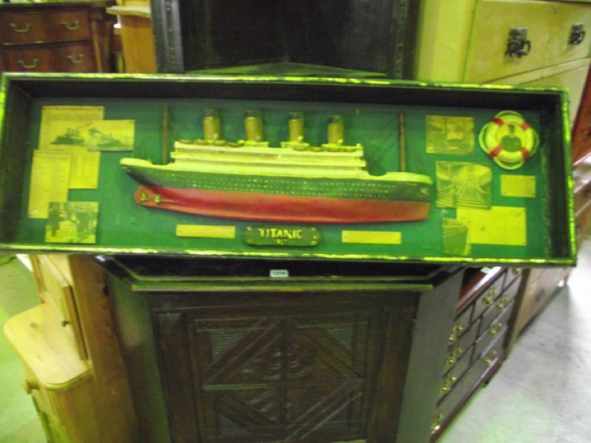 Appraisal: A wall mounted display case containing a half hull model