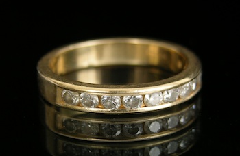 Appraisal: An k Gold and Diamond Band k yellow gold band