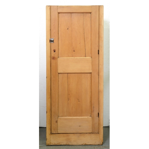 Appraisal: A pine cupboard fitted with shelves enclosed by panel door