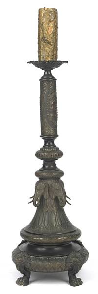 Appraisal: A patinated metal pricket in the Asian taste height in