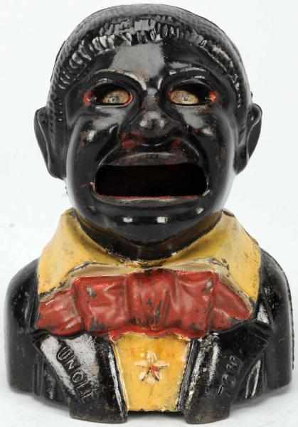 Appraisal: Cast Iron Uncle Tom Mechanical Bank Working Original paint and