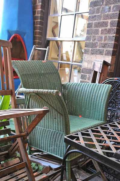 Appraisal: A GREEN PAINTED CANE WOVEN ARM CHAIR AND A CANE