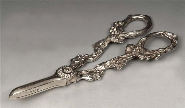 Appraisal: A PAIR OF SILVER GRAPE SCISSORS cast handles with grapevine