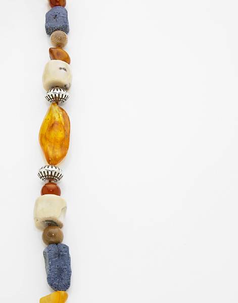 Appraisal: Coral Amber and Fossil Mammoth Tusk Necklace A stylish rope-length