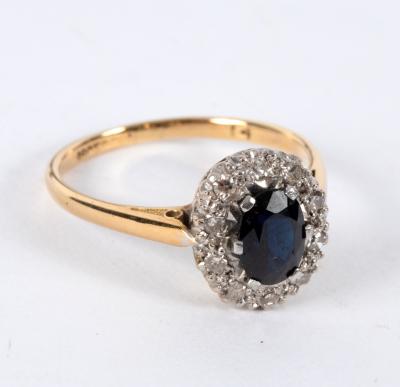 Appraisal: A sapphire and diamond cluster ring the oval sapphire to