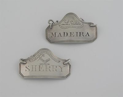 Appraisal: Two similar canted oblong wine labels with thread borders and