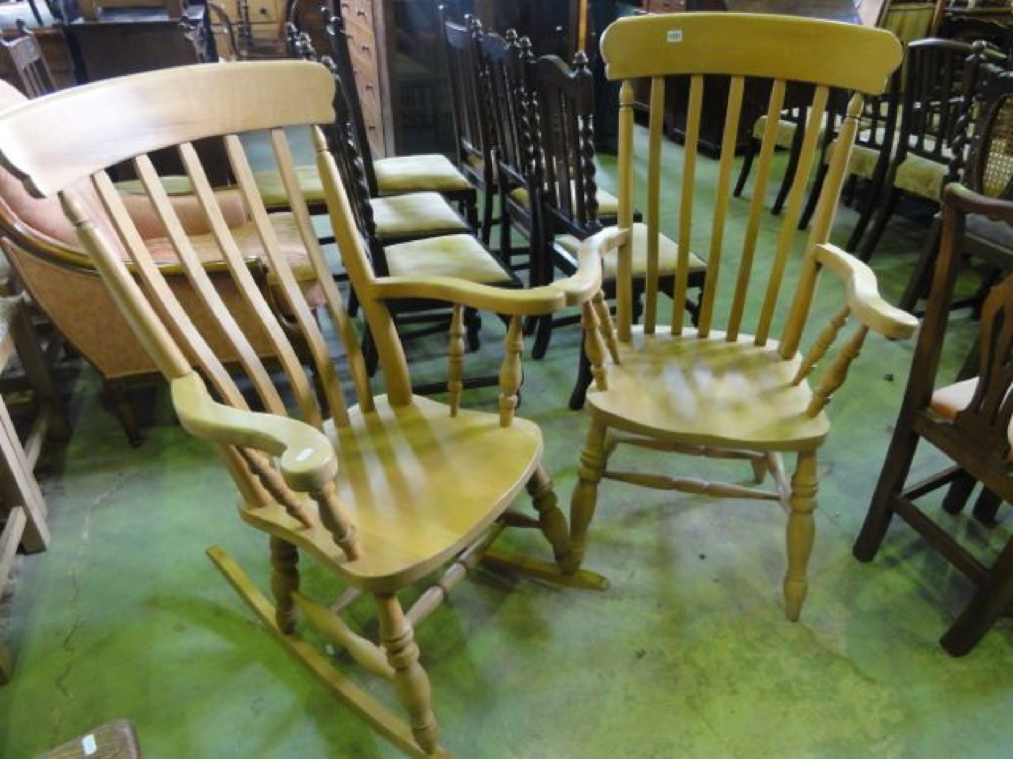 Appraisal: A reproduction Windsor style beechwood lath back kitchen elbow chair