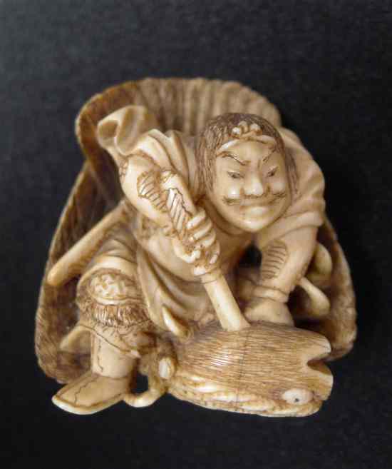 Appraisal: A Meiji period ivory netsuke carved as a warrior killing