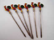 Appraisal: A set of six cocktail sticks the terminals with enamelled