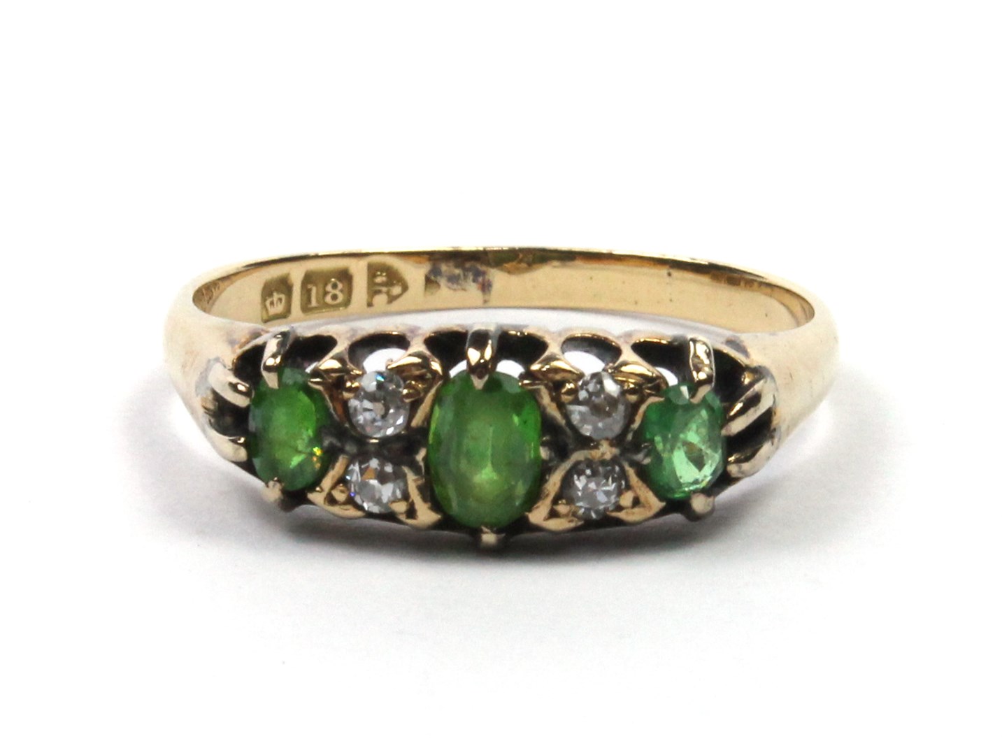 Appraisal: An ct gold demantoid garnet and diamond set ring mounted