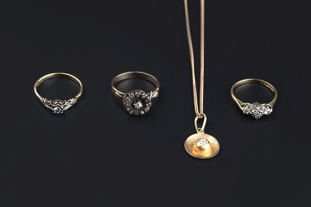 Appraisal: THREE DIAMOND SET RINGS AND A PENDANT comprising an old