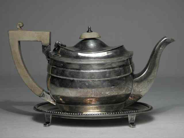 Appraisal: J E Caldwell English sterling silver teapot with stand Teapot