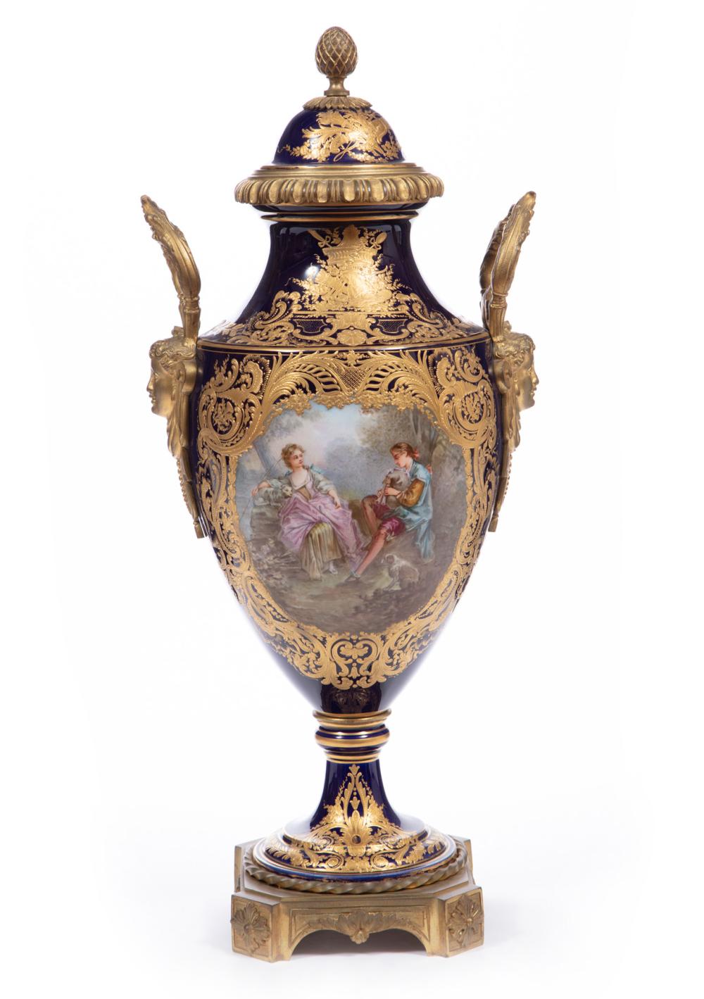 Appraisal: GILT BRONZE-MOUNTED SEVRES-STYLE PORCELAIN VASEGilt Bronze-Mounted Sevres-Style Bleu de Roi