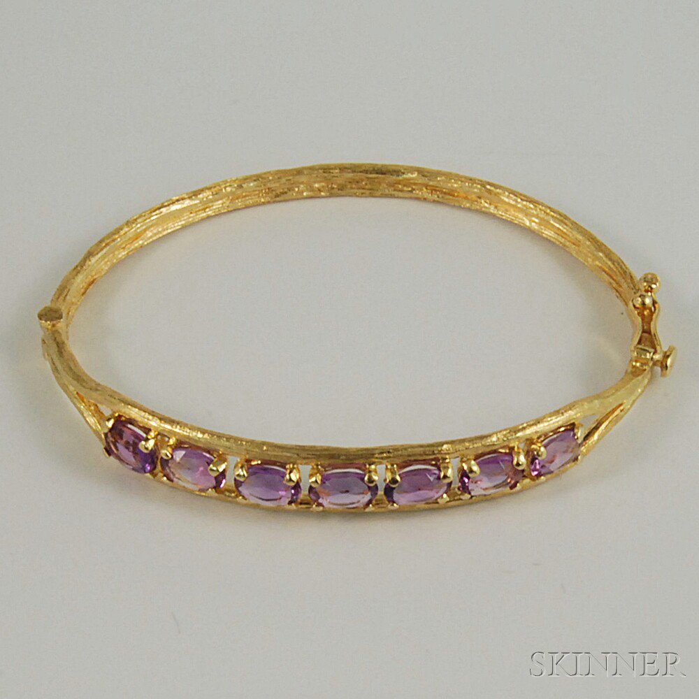 Appraisal: kt Gold and Amethyst Hinged Bangle Bracelet the textured gold