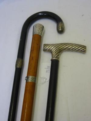 Appraisal: A MALACCA CANE with foliate chased silver grip and collar