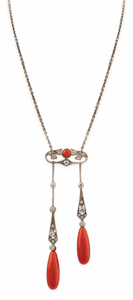 Appraisal: AN EDWARDIAN STYLE CORAL AND DIAMOND NECKLACE The pierced diamond