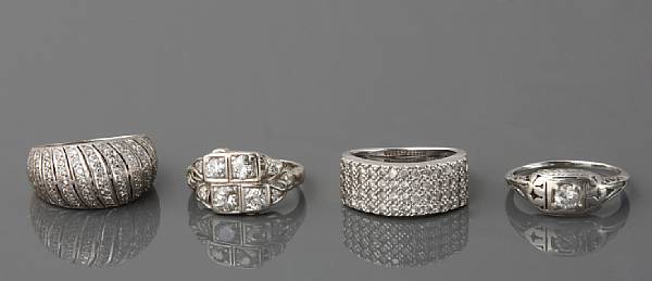 Appraisal: A collection of four diamond and white gold rings estimated