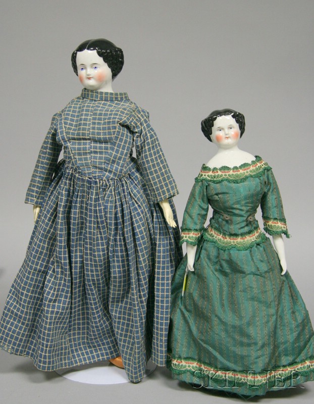 Appraisal: Two China Shoulder Head Dolls both with center-parted black hair