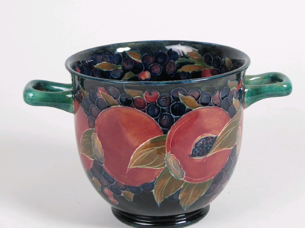 Appraisal: A Moorcroft two handled Vase pomegranate design on a dark