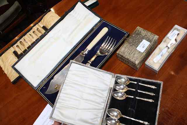 Appraisal: A HEXAGONAL SHAPED SILVER NAPKIN RING with leaf shaped border