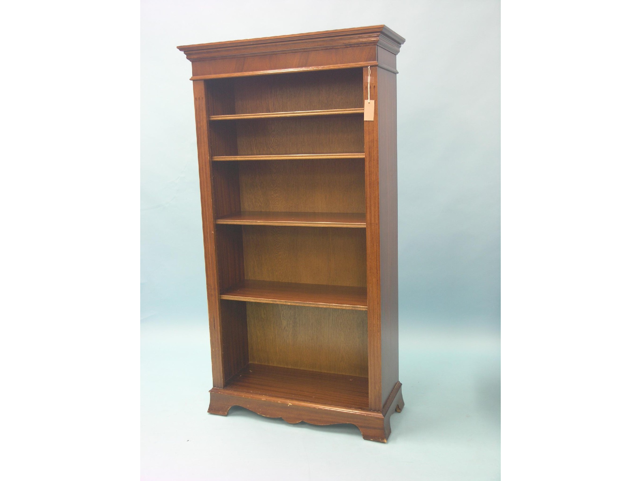 Appraisal: A reproduction mahogany open bookcase four adjustable shelves ft in