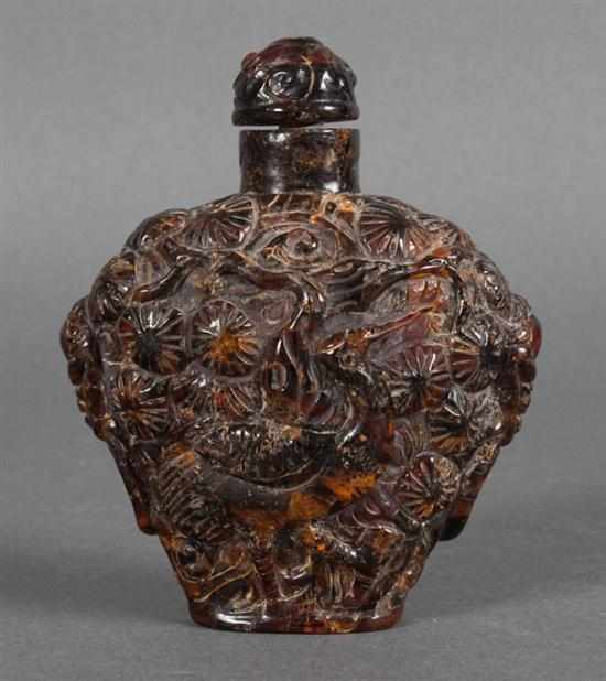 Appraisal: Chinese carved amber snuff bottle with crane and lotus relief