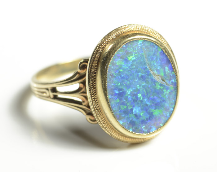 Appraisal: OPAL AND FOURTEEN KARAT GOLD RING set with a single