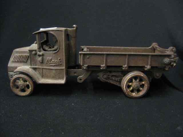 Appraisal: Cast Iron Toy Mack Truck with driver '' long ''