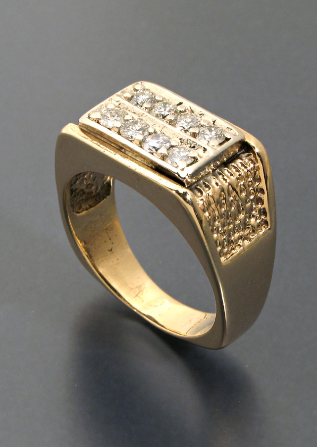 Appraisal: MAN'S DIAMOND AND FOURTEEN KARAT GOLD RING set with two