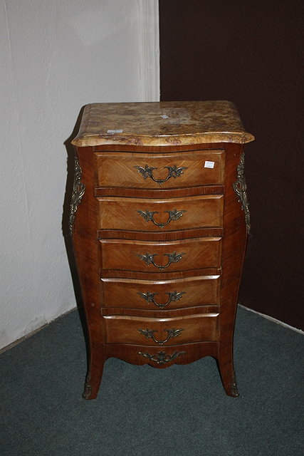 Appraisal: A FRENCH KINGWOOD NARROW CHEST OF DRAWERS with marble top