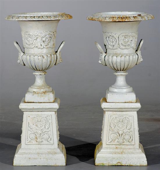 Appraisal: Pair Classical style painted cast-iron garden urns on pedestals flared