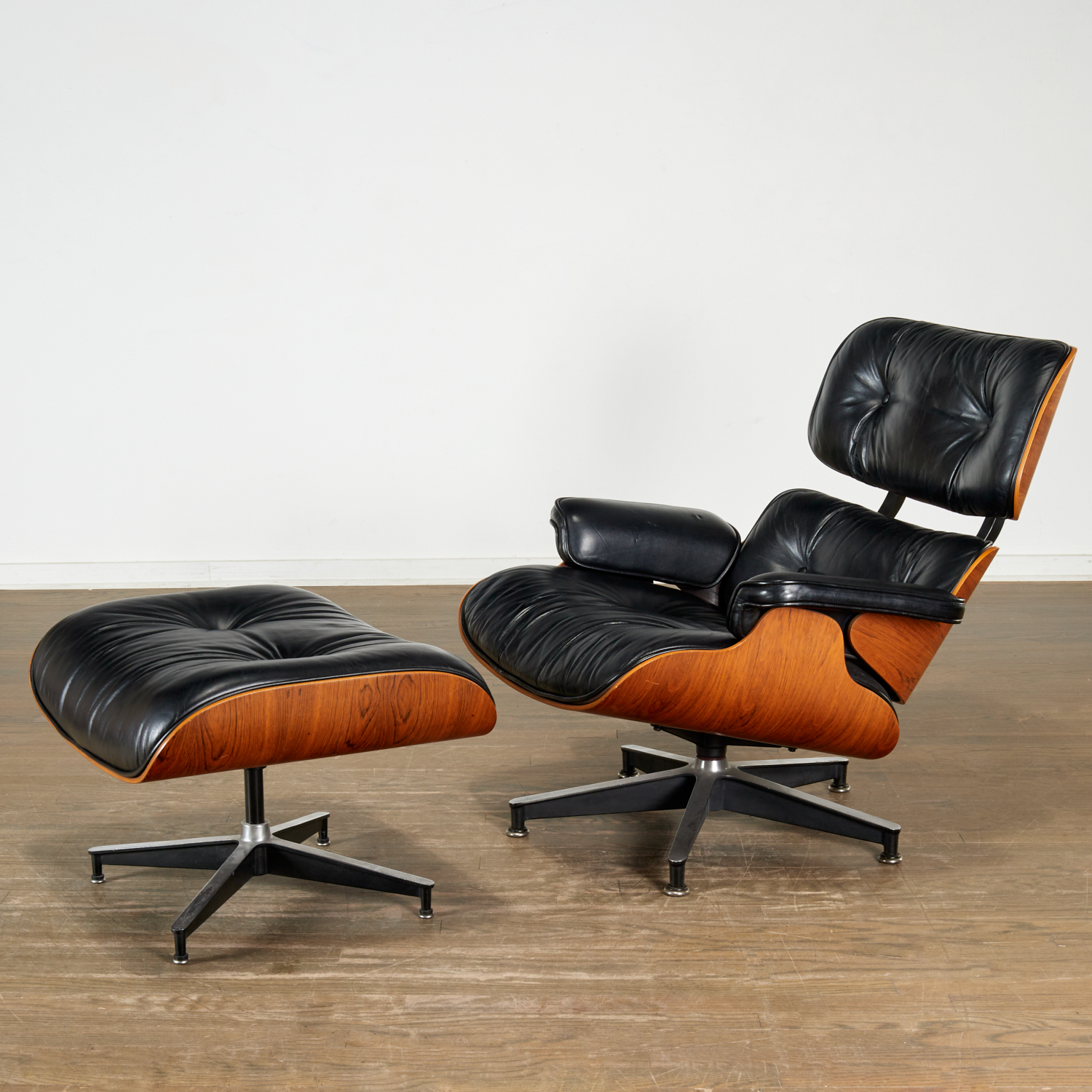 Appraisal: CHARLES RAY EAMES EAMES LOUNGE AND OTTOMAN molded rosewood plywood