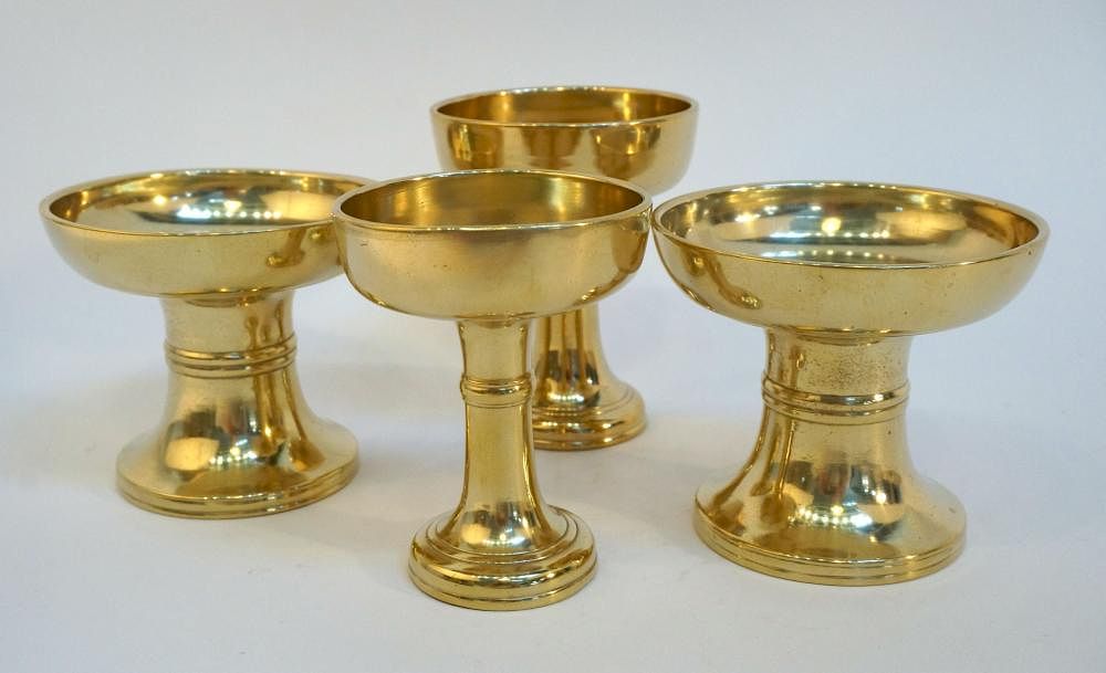 Appraisal: Four Solid Spun Brass Sake Cups Four Solid Spun Brass