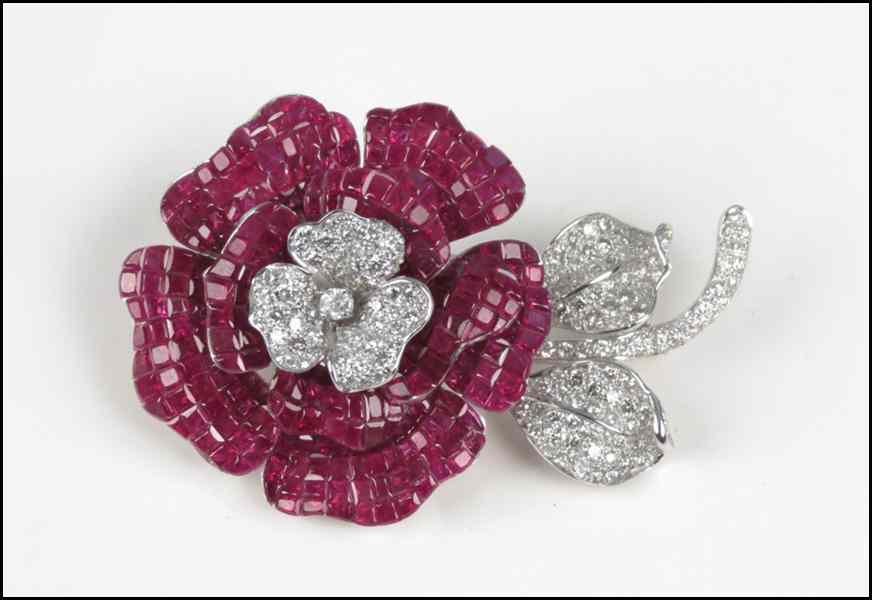 Appraisal: DIAMOND RUBY AND KARAT WHITE GOLD FLOWER CLIP BROOCH Comprised