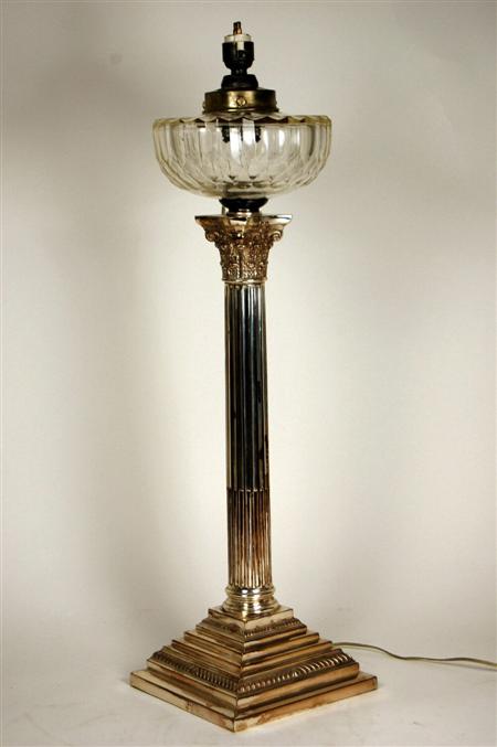 Appraisal: A Victorian silver plated Corinthian column oil lamp with a