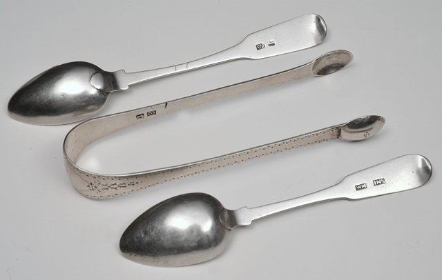 Appraisal: A PAIR OF SCOTTISH PROVINCIAL SILVER TONGS bright cut Inverness