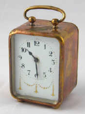 Appraisal: A brass cased bedside alarm clock circa with gilt decorated