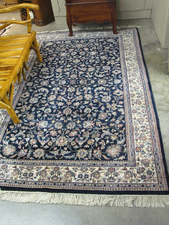 Appraisal: HAND KNOTTED ORIENTAL AREA RUG Indo-Persian overall floral tracery on