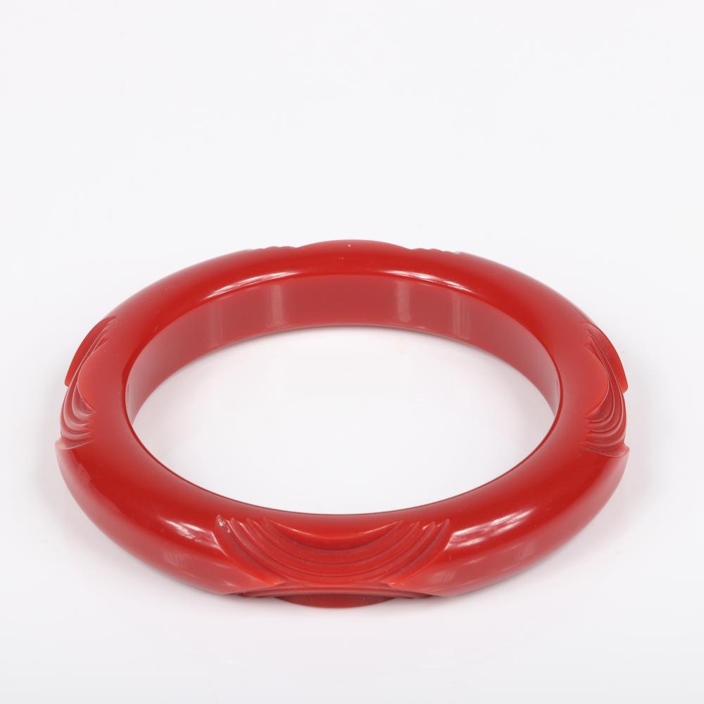 Appraisal: TWO FRENCH BAKELITE POSSIBLY GALALITH BRACELETS IN RED AND GOLD