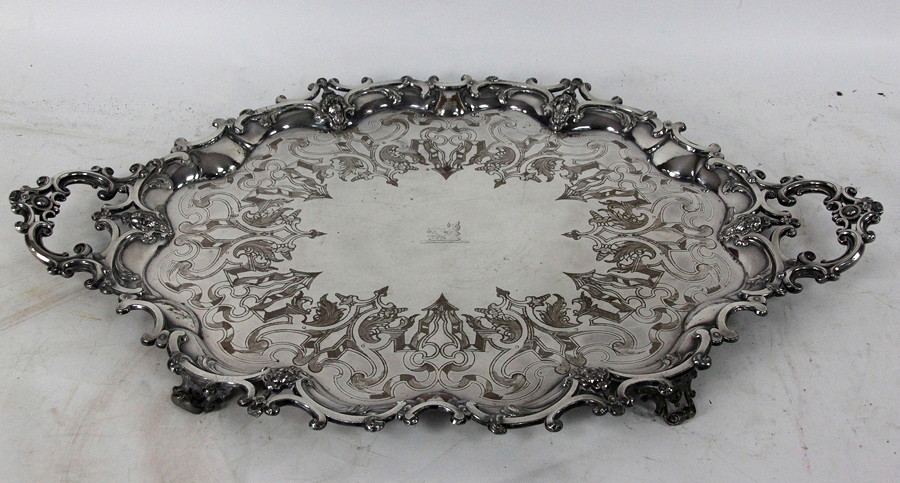 Appraisal: A large plated tray of scrolling outline with scrolling handles