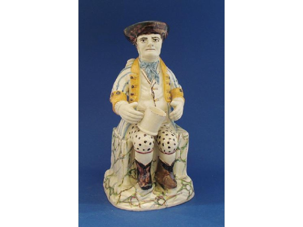 Appraisal: A LARGE PRATTWARE CHARACTER TOBY JUG depicting a Hearty Goodfellow