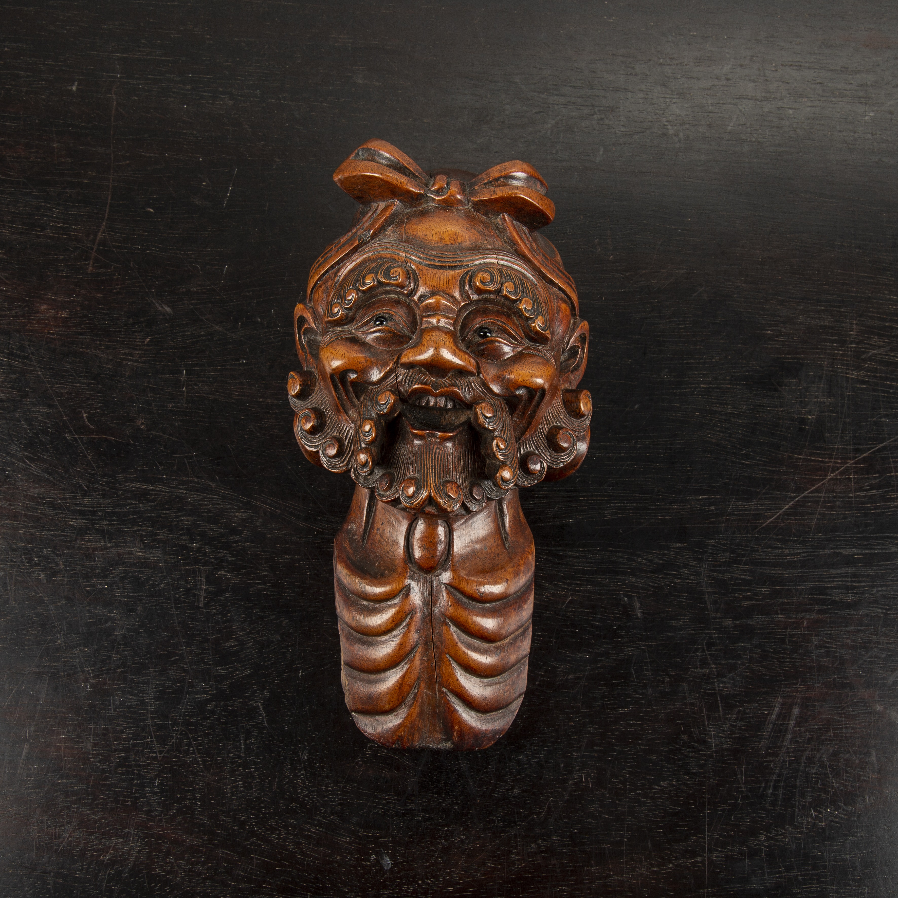 Appraisal: Carved boxwood headJapanese Meiji period the bearded figure with ribbon