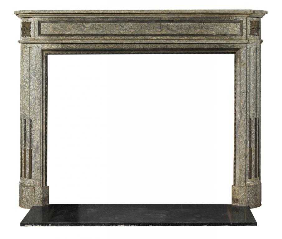 Appraisal: A VERT D'ESTOURS GREEN MARBLE CHIMNEYPIECE the frieze applied with