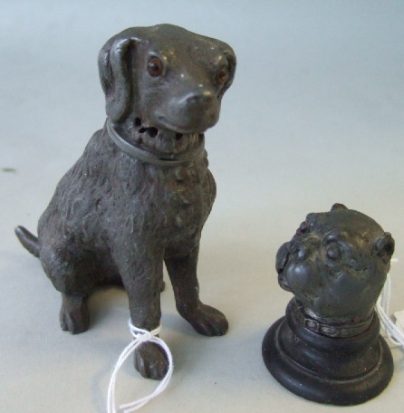 Appraisal: A hollowcast lead inkwell modelled as the head of a