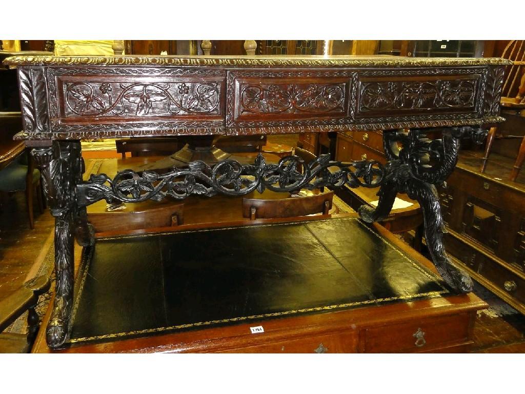 Appraisal: An Anglo Indian hardwood centre sofa table the rectangular top