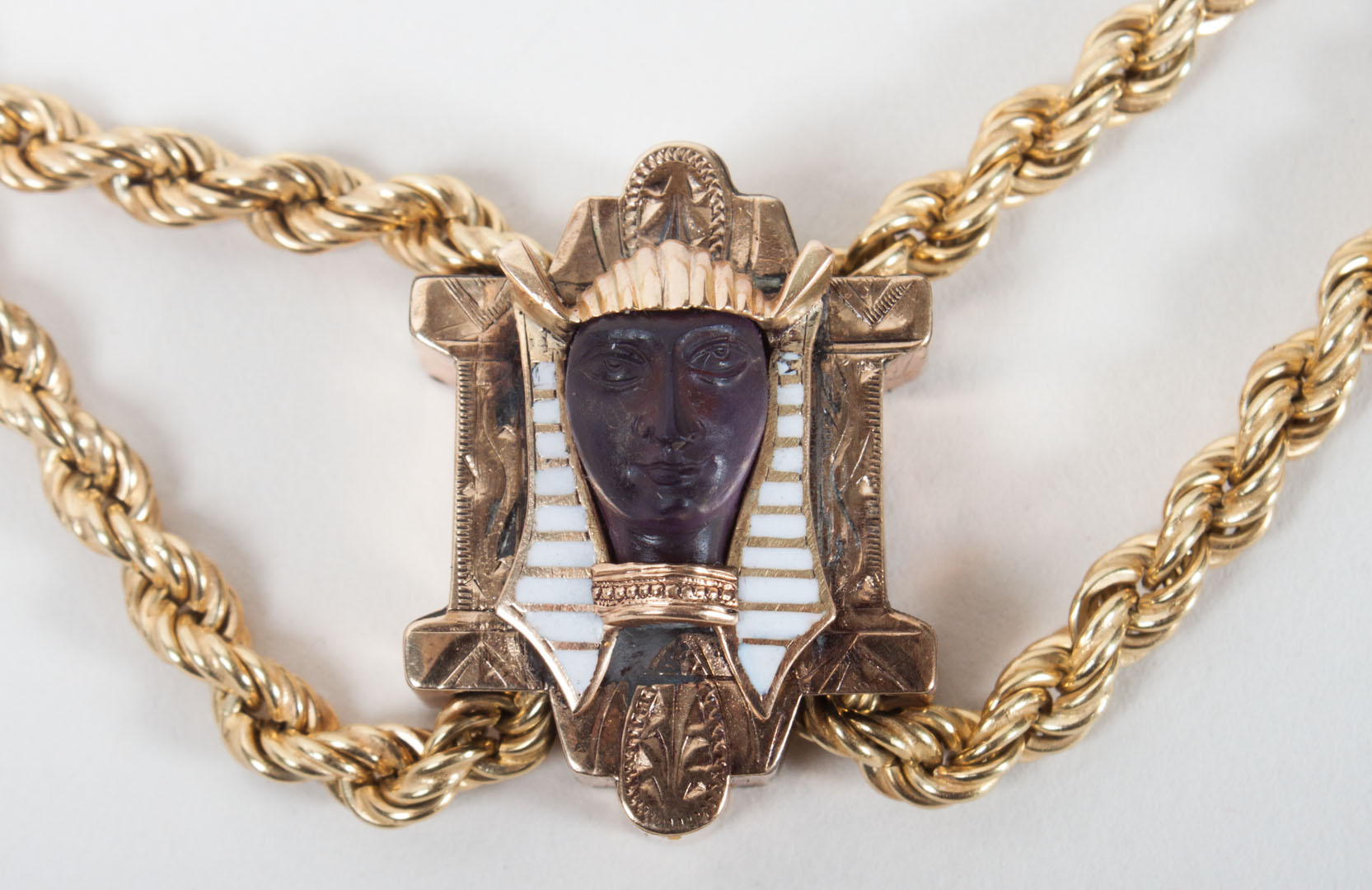 Appraisal: Egyptian revival style gold slide pendant chain pat about in