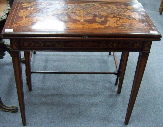 Appraisal: An th Century Dutch marquetry card table with concertina action